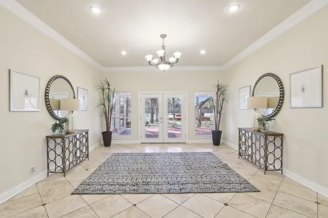a kitchen with granite countertop a counter space chairs cabinets and appliances