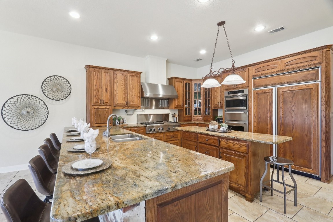 294 Logan Ranch Road Georgetown, TX 78628 - Photo 9 of 40 a large kitchen with a table and chairs