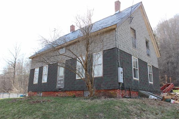 91 Foundry Village Road Colrain, MA 01340 - Photo 1 of 10 a view of a brick house next to a yard