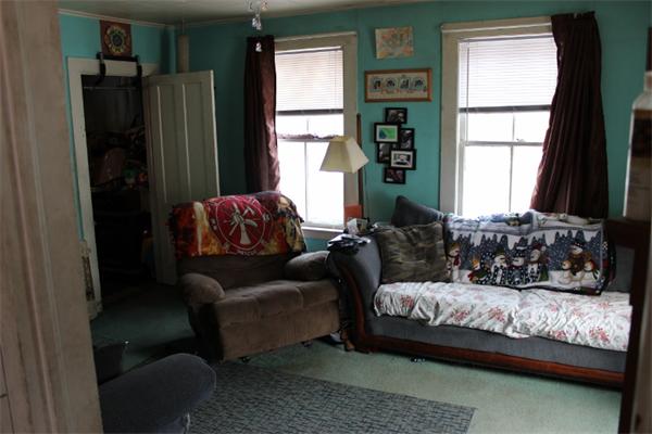 91 Foundry Village Road Colrain, MA 01340 - Photo 4 of 10 a living room with furniture window and a refrigerator