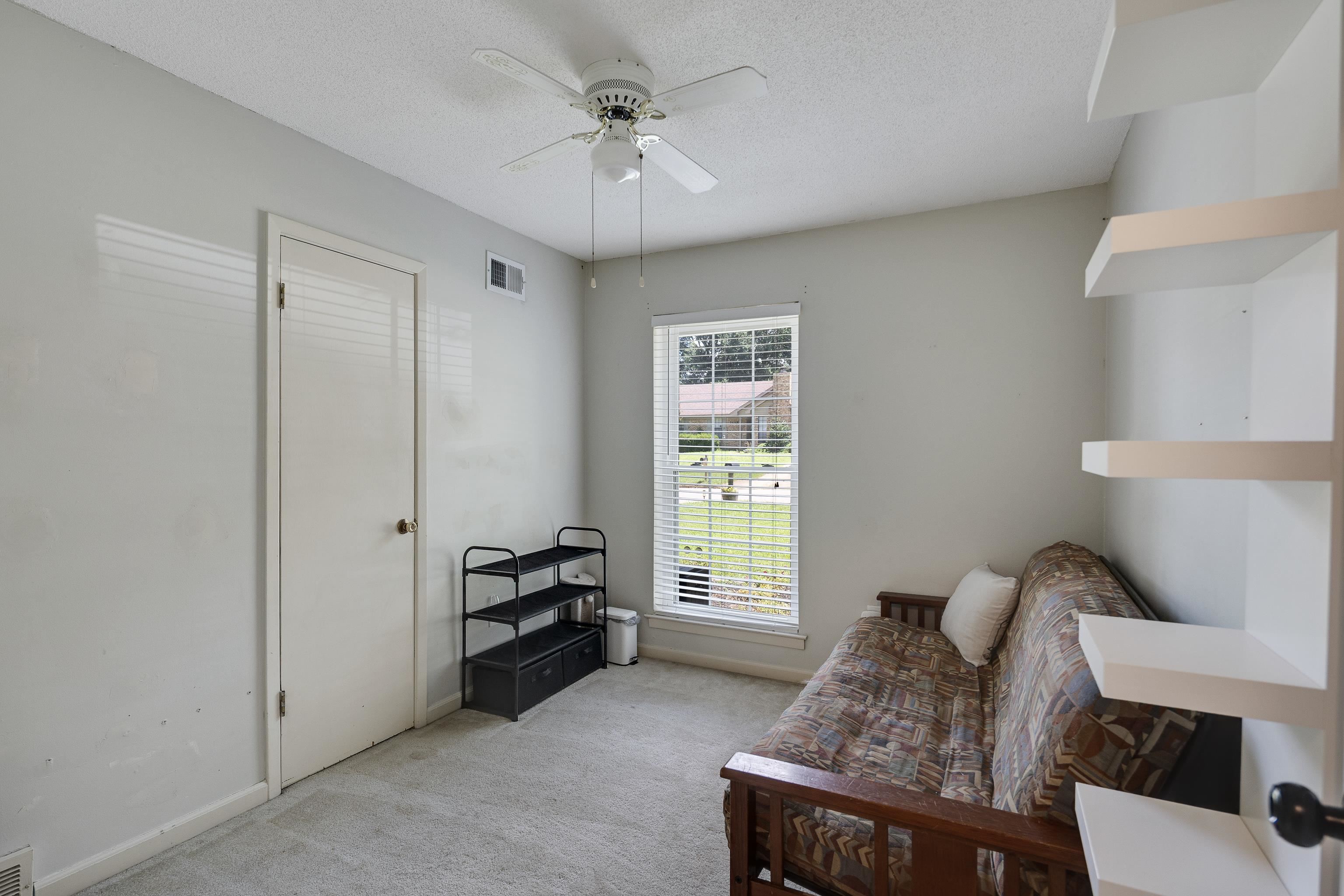 1137 Greenview Road Collierville, TN 38017 - Photo 18 of 35 a bedroom with furniture and a window