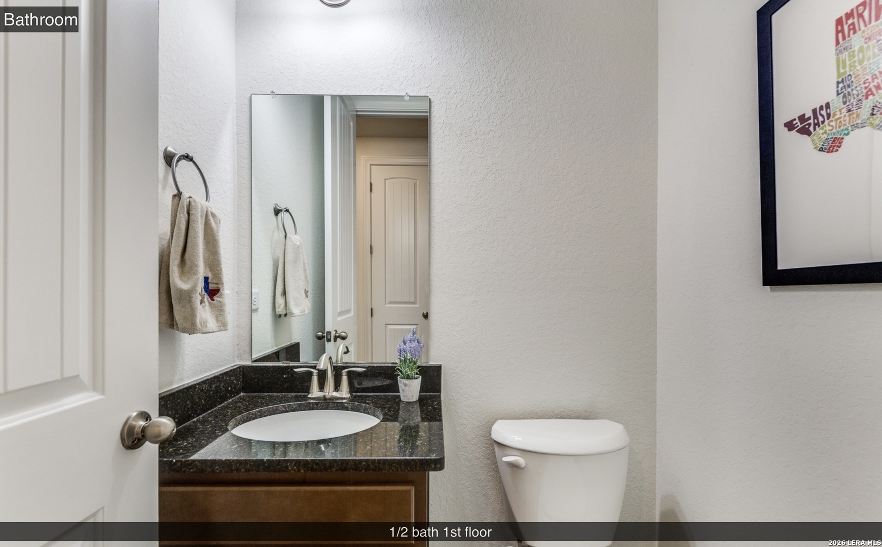 390 Rhapsody View Spring Branch, TX 78070 - Photo 16 of 28 a bathroom with a granite countertop sink and a mirror