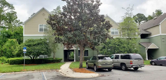 a view of a car parked in front of a house