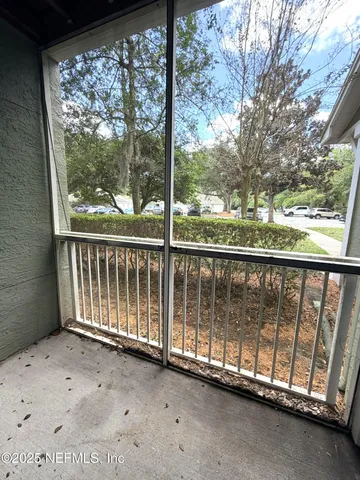 a view of a porch with a yard