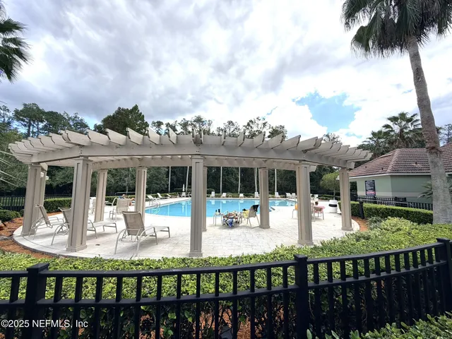 a view of a house with backyard and porch