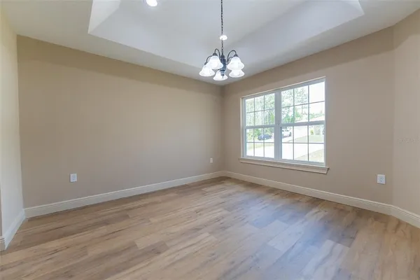 a large kitchen with stainless steel appliances granite countertop a granite counter tops and a wooden floors