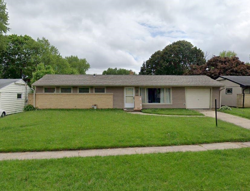 4803 Highcrest Road Rockford, IL 61107 - Photo 1 of 1 a view of a house with a backyard