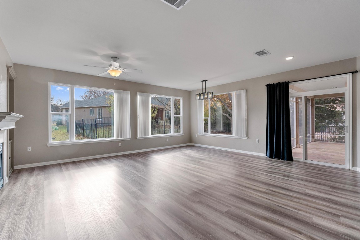 122 Nolan Drive Georgetown, TX 78633 - Photo 11 of 35 a view of an empty room with wooden floor and a window