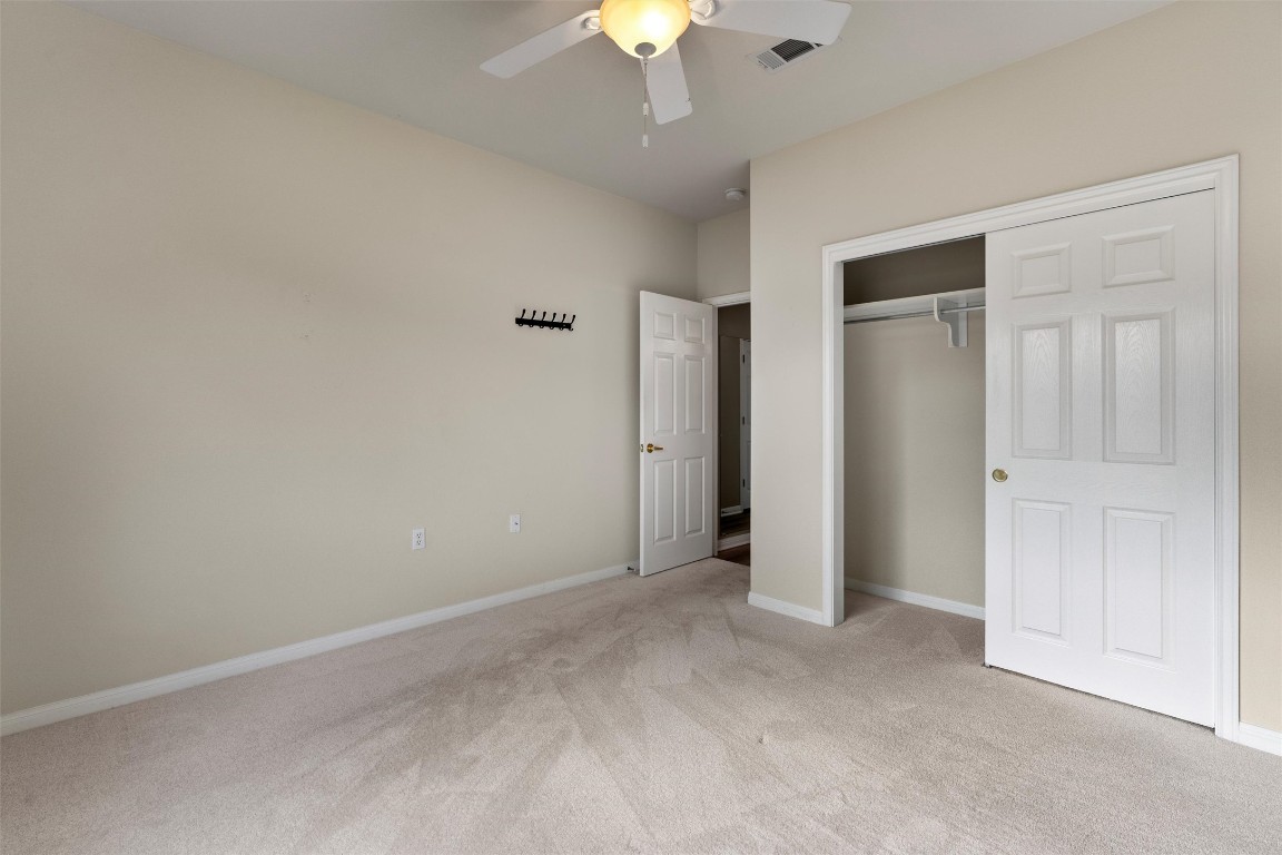 122 Nolan Drive Georgetown, TX 78633 - Photo 23 of 35 a view of an empty room with a chandelier fan