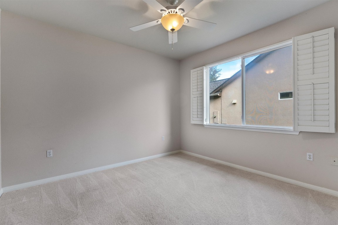 122 Nolan Drive Georgetown, TX 78633 - Photo 25 of 35 a view of an empty room with window and chandelier fan