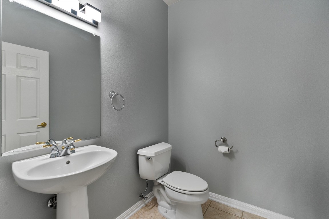 122 Nolan Drive Georgetown, TX 78633 - Photo 28 of 35 a bathroom with a sink a toilet and mirror