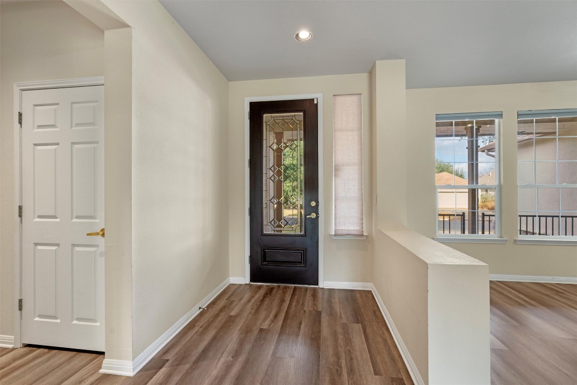 122 Nolan Drive Georgetown, TX 78633 - Photo 3 of 35 wooden floor in an empty room with a window