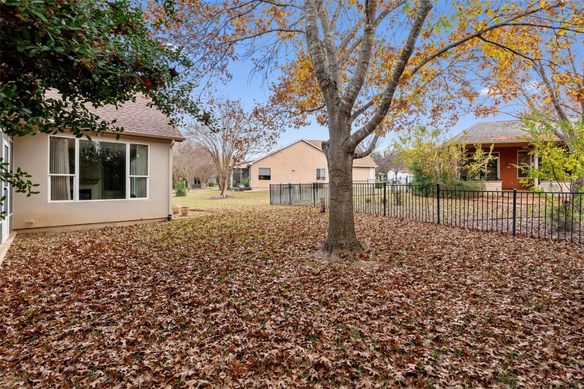 122 Nolan Drive Georgetown, TX 78633 - Photo 31 of 35 a backyard of a house with lots of green space