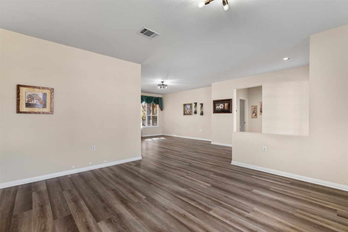 122 Nolan Drive Georgetown, TX 78633 - Photo 5 of 35 a view of a room with wooden floor and white walls
