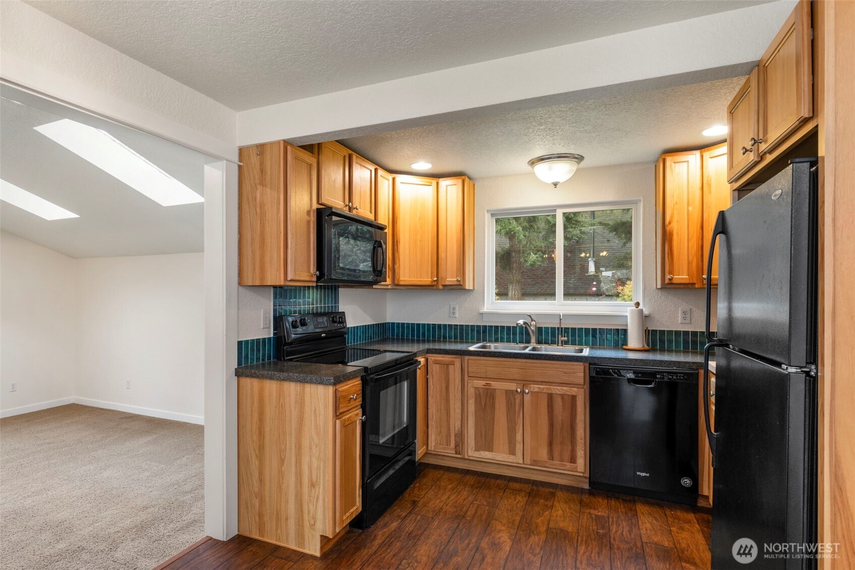 101 D Street Port Hadlock, WA 98339 - Photo 11 of 36 a kitchen with granite countertop a sink stove and refrigerator