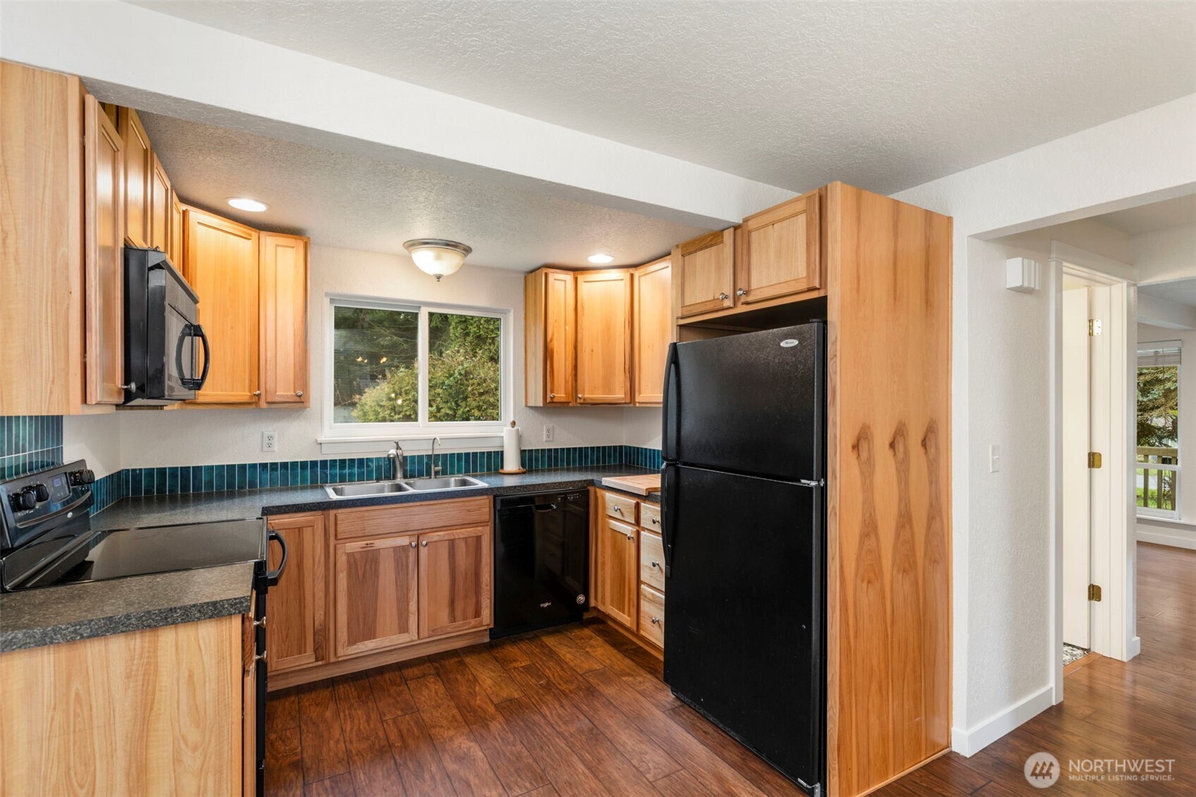 101 D Street Port Hadlock, WA 98339 - Photo 12 of 36 a kitchen with granite countertop stainless steel appliances a refrigerator and a sink