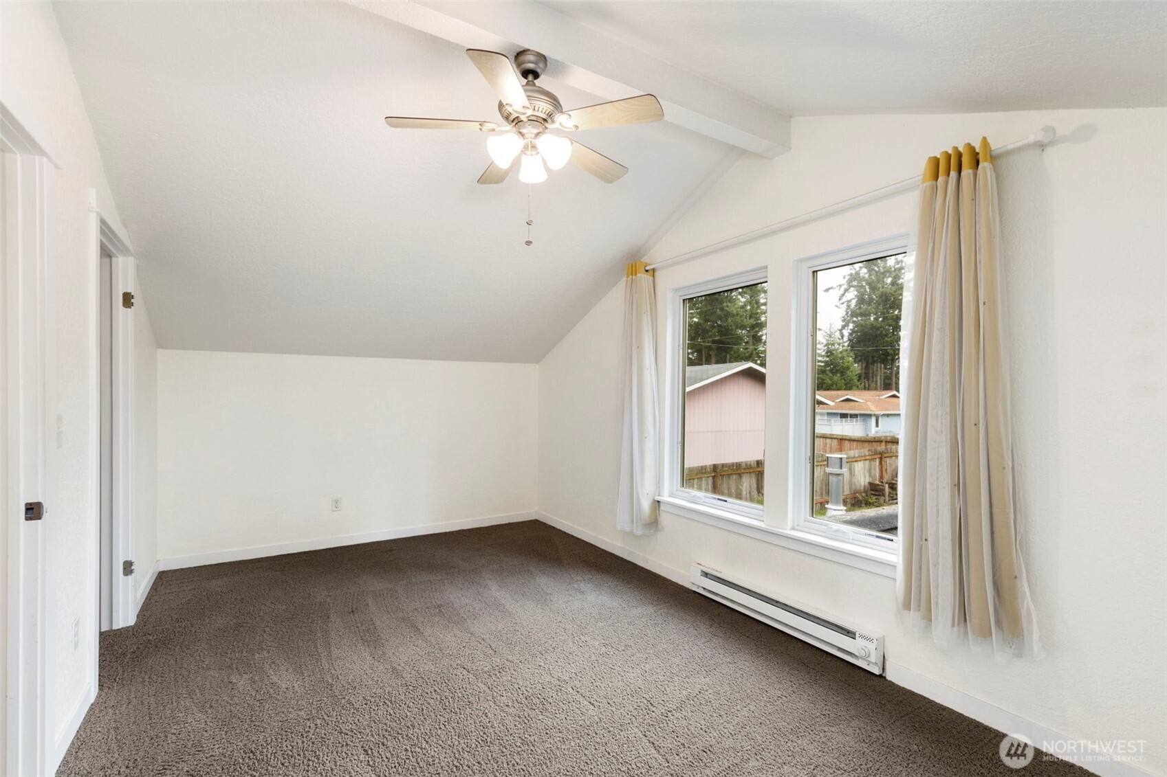 101 D Street Port Hadlock, WA 98339 - Photo 19 of 36 an empty room with a large window chandelier fan