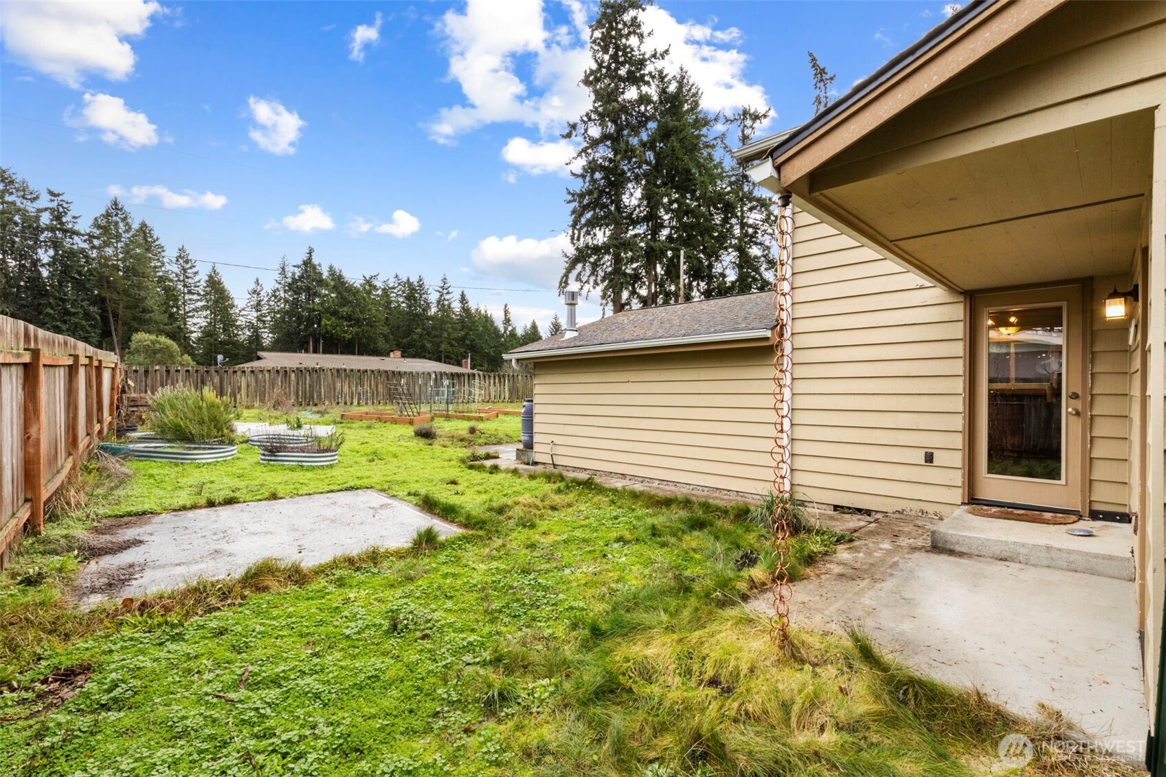 101 D Street Port Hadlock, WA 98339 - Photo 26 of 36 a view of backyard with a garden and plants