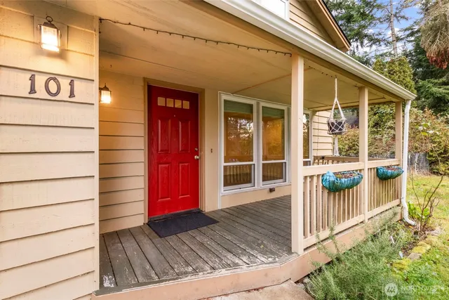 a view of a house with a door and wooden floor