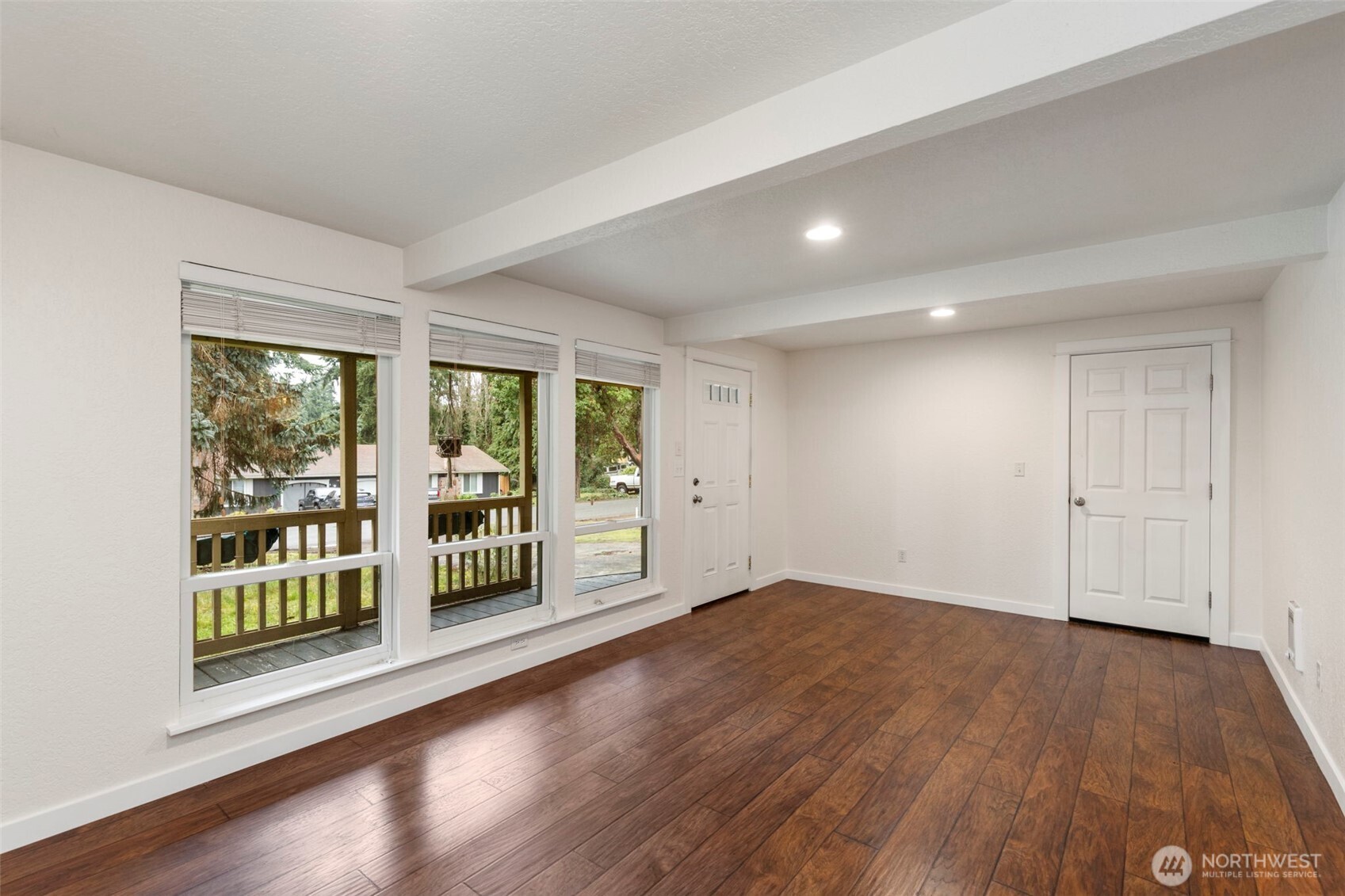 101 D Street Port Hadlock, WA 98339 - Photo 8 of 36 a view of an empty room with wooden floor and a window
