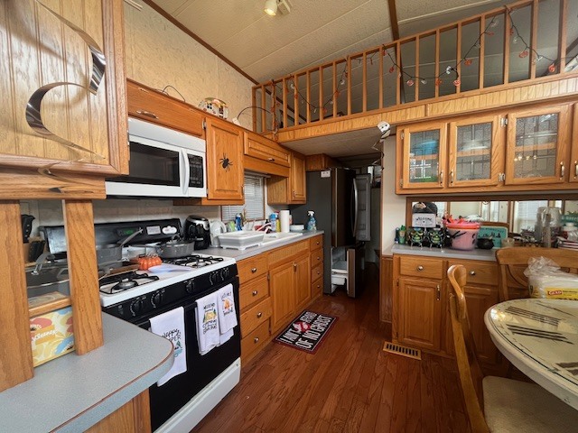 2795 East 28th Road Marseilles, IL 61341 - Photo 8 of 23 a kitchen with stainless steel appliances granite countertop a stove and cabinets