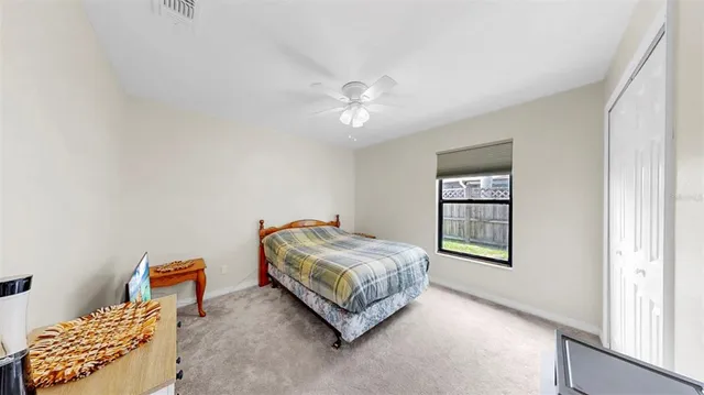 a living room with a couch and chandelier