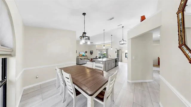 a view of a kitchen and dining room