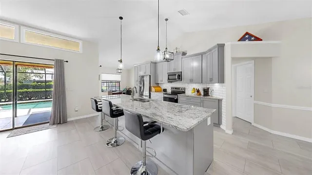 a view of kitchen center island and living room
