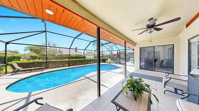 a room with pool table and glass door