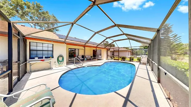 a view of a swimming pool with a lounge chairs