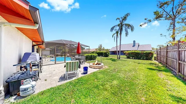 a view of swimming pool with a patio and a garden