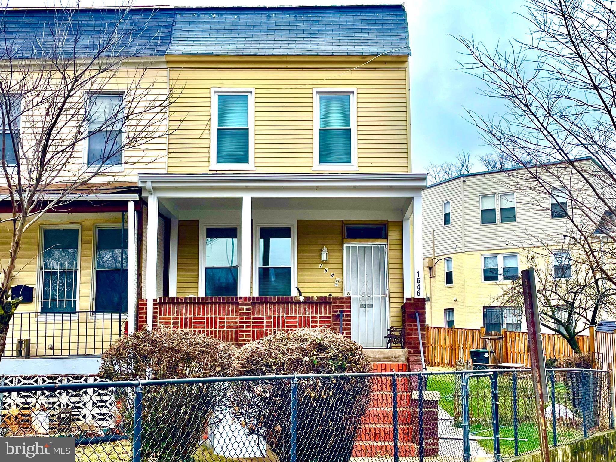 1646 Trinidad Avenue Northeast Washington, DC 20002 - Photo 3 of 10 front view of a brick house with large windows