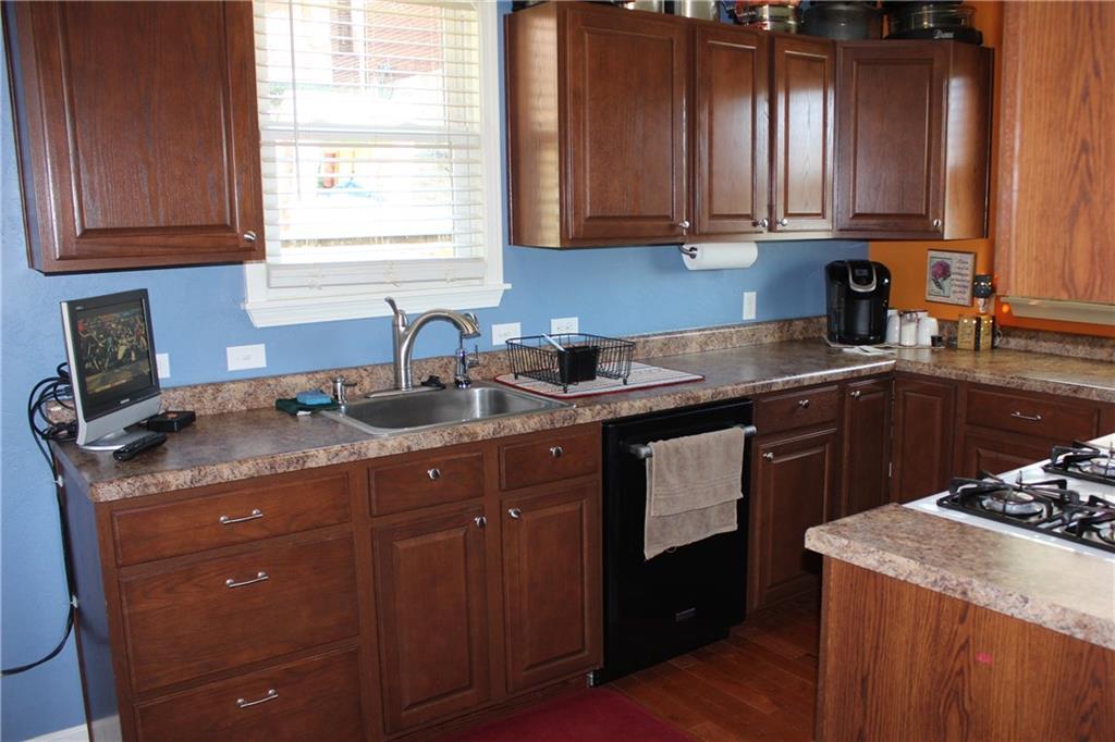 1412 Brinton Road Pittsburgh, PA 15221 - Photo 5 of 25 Dishwasher and nice sink fixture.