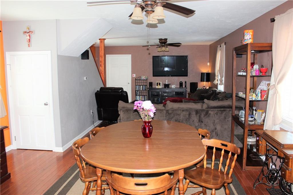 1412 Brinton Road Pittsburgh, PA 15221 - Photo 9 of 25 Another view of the open floor plan with a wall mounted tv.