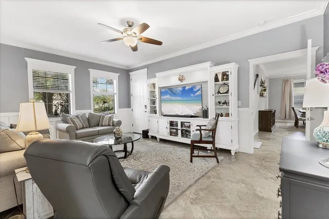a view of living room filled with furniture and washer
