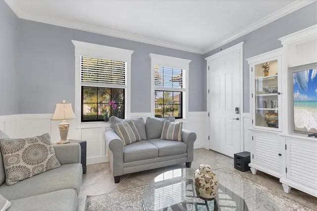 a view of a patio with table and chairs under an umbrella with wooden floor