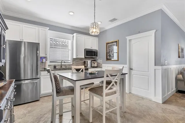 an aerial view of a building with garden space and lake view