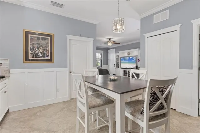 a front view of multi story residential apartment building with yard and sign board