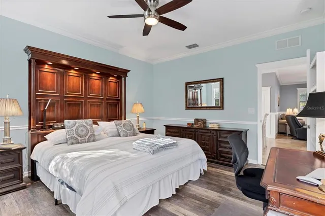 a living room with furniture a fireplace and a chandelier