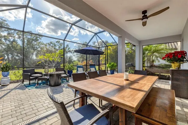 a view of a swimming pool and outside seating area