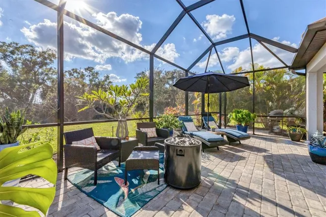 a view of a swimming pool with outdoor seating