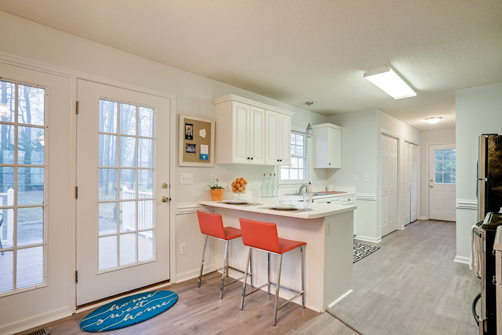 4410 Rhew Drive Durham, NC 27704 - Photo 5 of 13 Nice breakfast bar! French doors to back deck. Eat-in Kitchen!