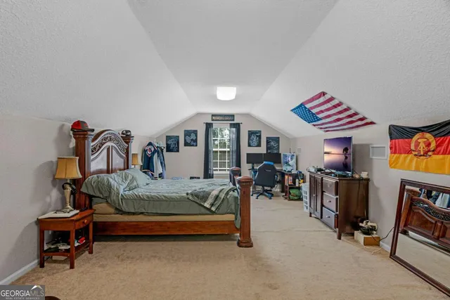 a aerial view of a house next to a big yard