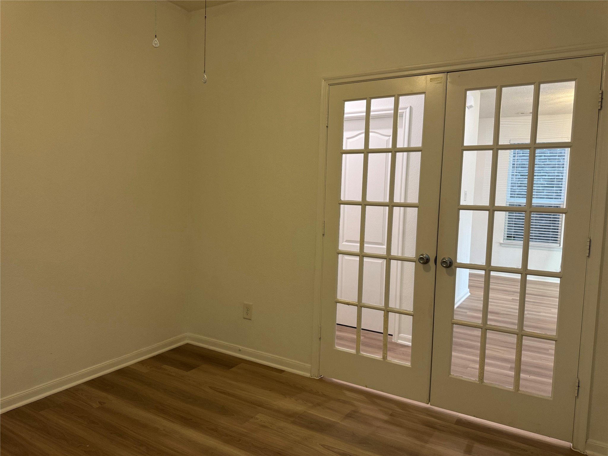15815 Copper Oak Lane Houston, TX 77084 - Photo 13 of 33 wooden floor in an empty room with a window