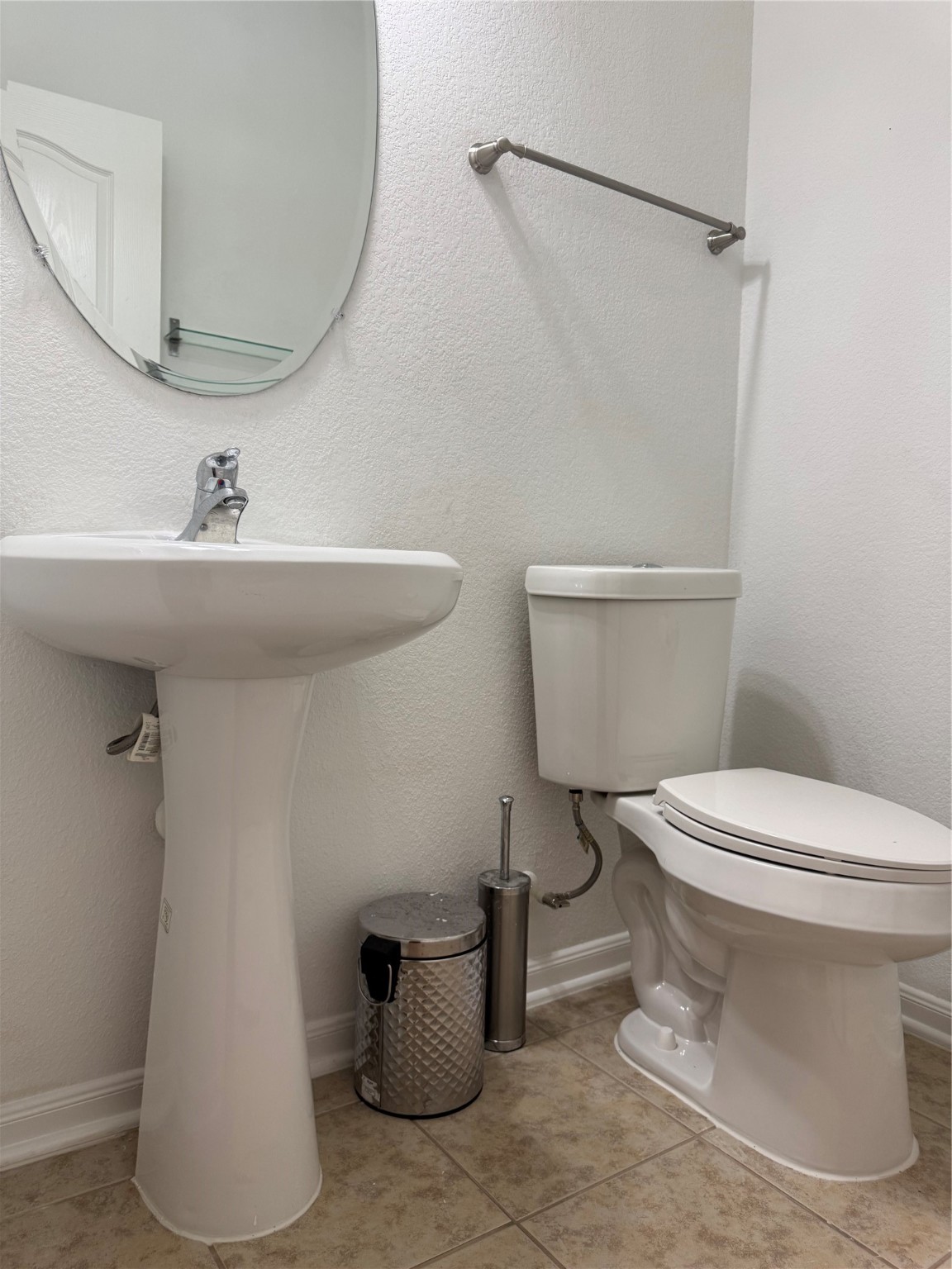 15815 Copper Oak Lane Houston, TX 77084 - Photo 14 of 33 a white toilet sitting next to a bathroom sink