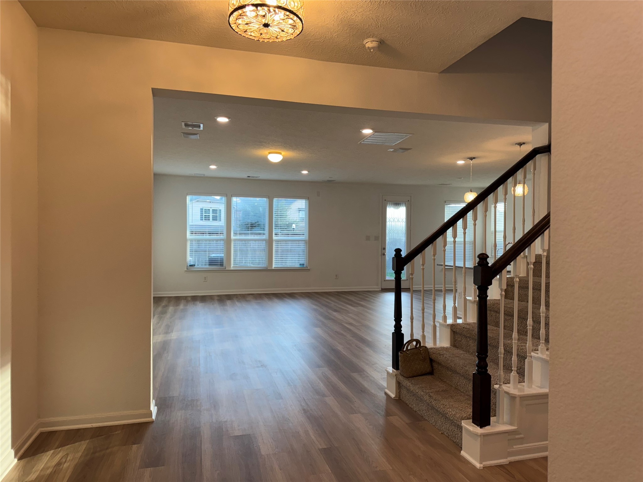 15815 Copper Oak Lane Houston, TX 77084 - Photo 5 of 33 a view of entryway with wooden floor and stairs