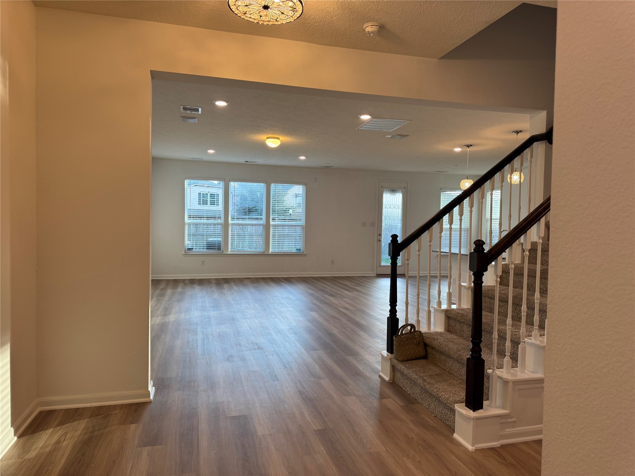 15815 Copper Oak Lane Houston, TX 77084 - Photo 9 of 33 a view of entryway with wooden floor and stairs