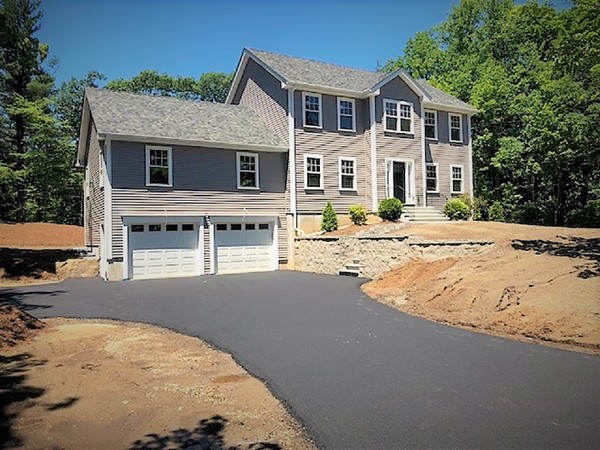 1028 Hill Road Boxborough, MA 01719 - Photo 1 of 1 a front view of a house with a yard