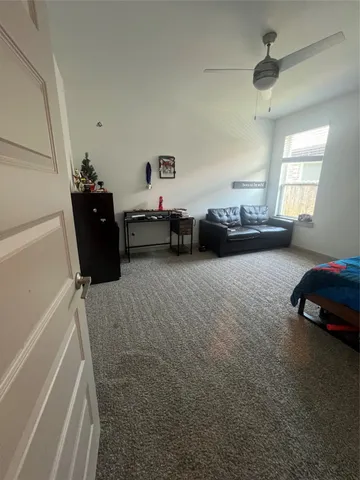 a bedroom with bed and window