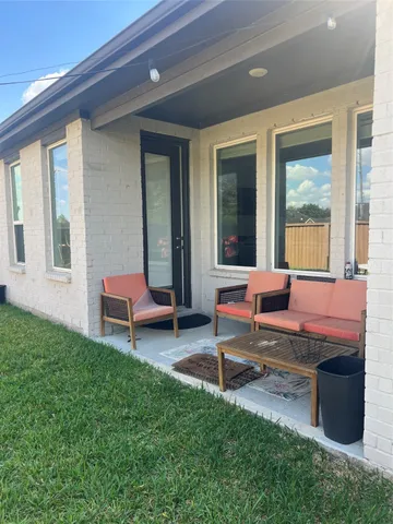 a view of a patio with swimming pool
